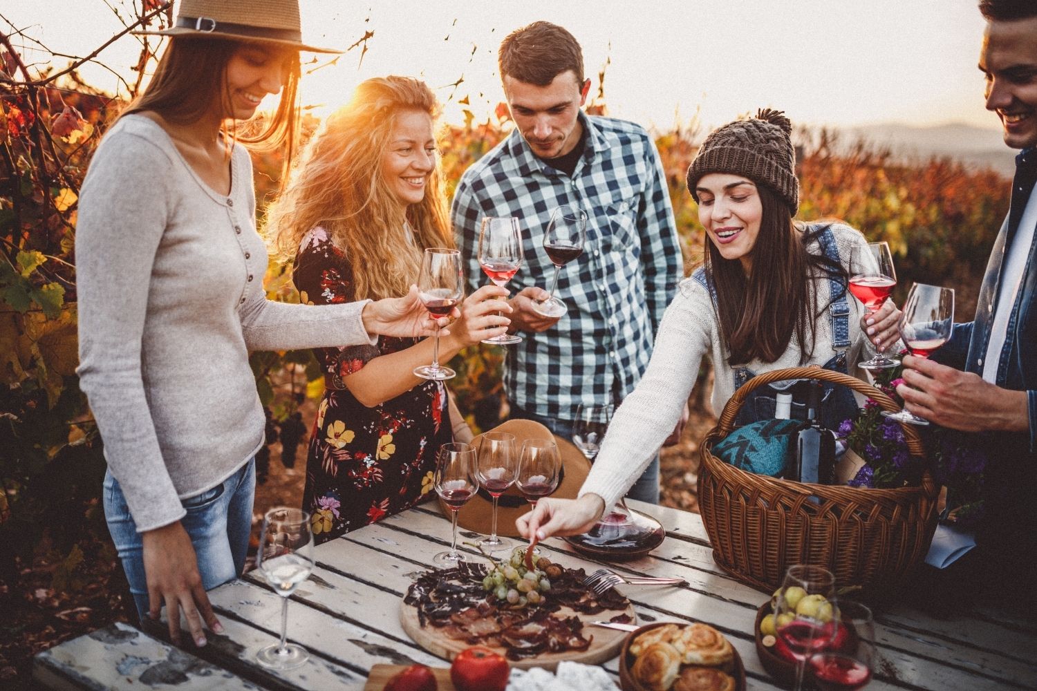 Five-people-laughing-toasting-enjoying-wine-culinary-delights